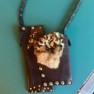 One of a kind hand crafted leather and fur crossbody